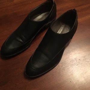 Black leather Tibi flats